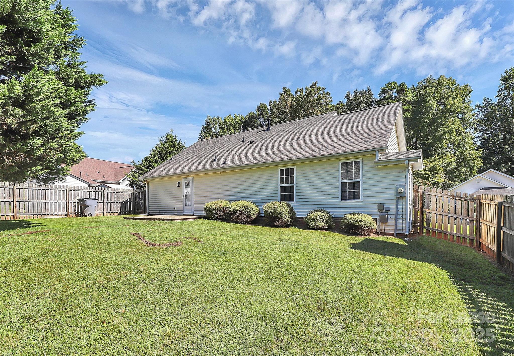 6320 Fresh Wind Avenue Charlotte, NC 28212 - Photo 29 of 31 a view of a house with a yard and fence