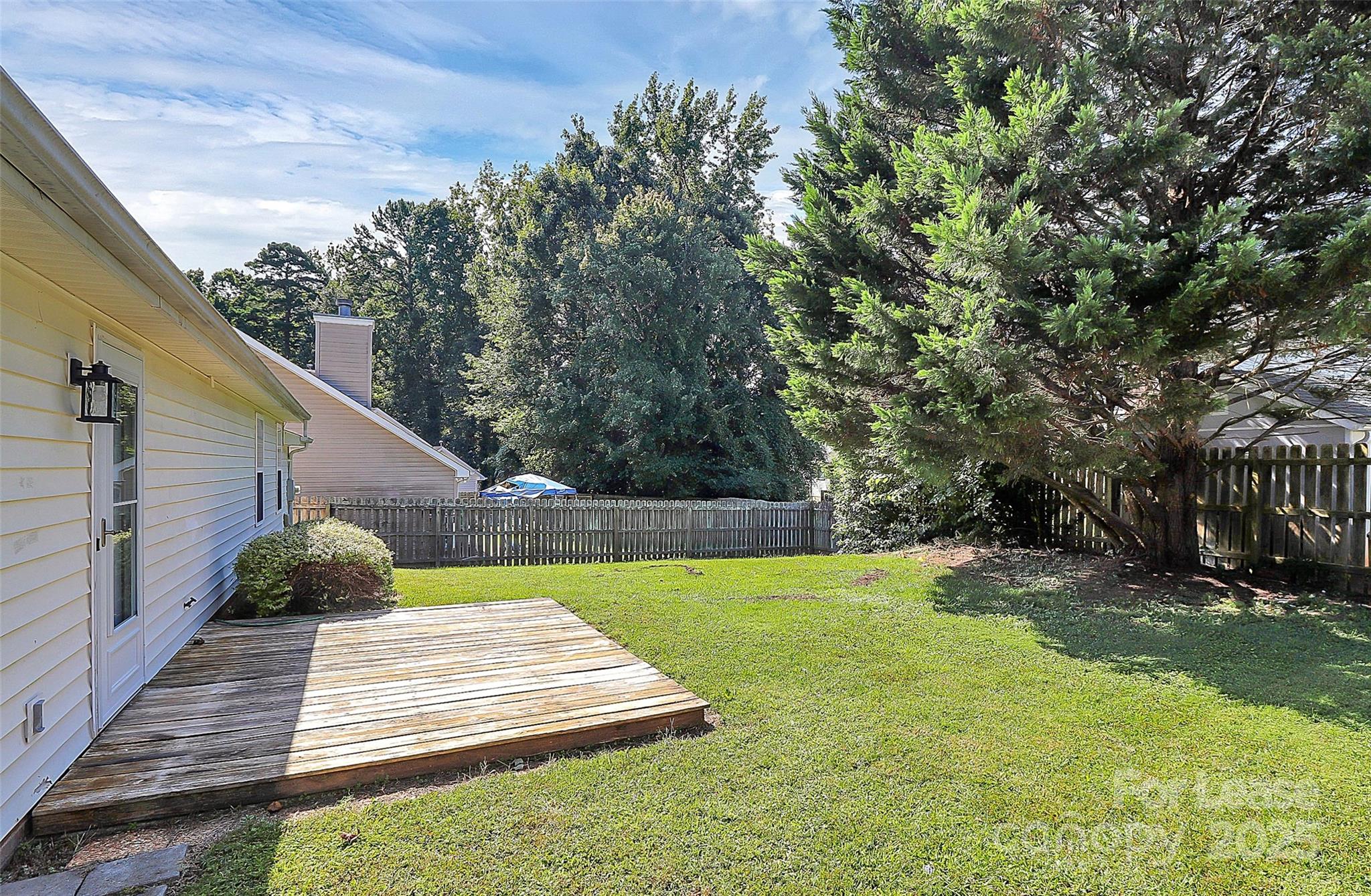 6320 Fresh Wind Avenue Charlotte, NC 28212 - Photo 30 of 31 a view of a backyard with sitting area