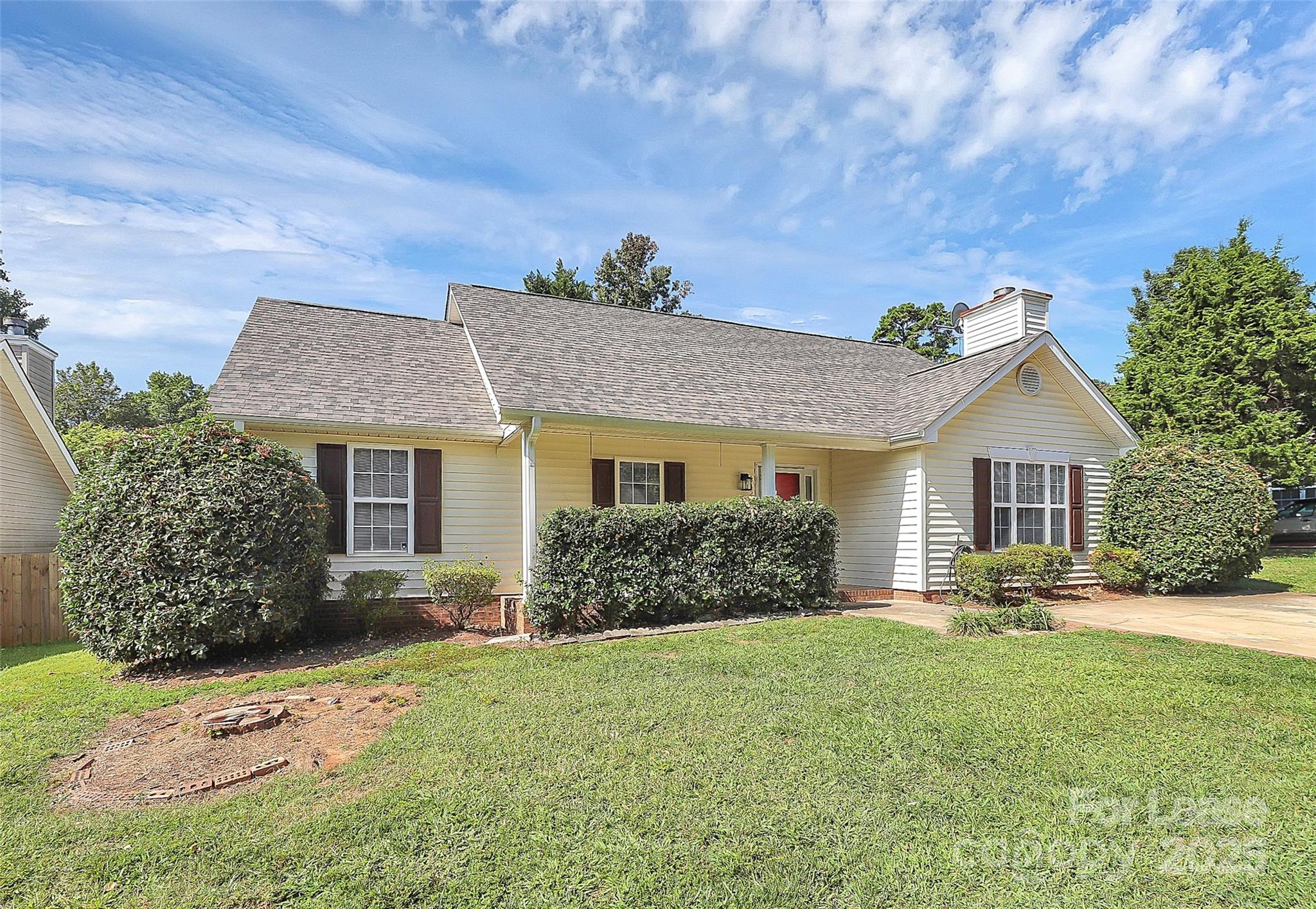 6320 Fresh Wind Avenue Charlotte, NC 28212 - Photo 3 of 31 a front view of house with yard and trees in the background