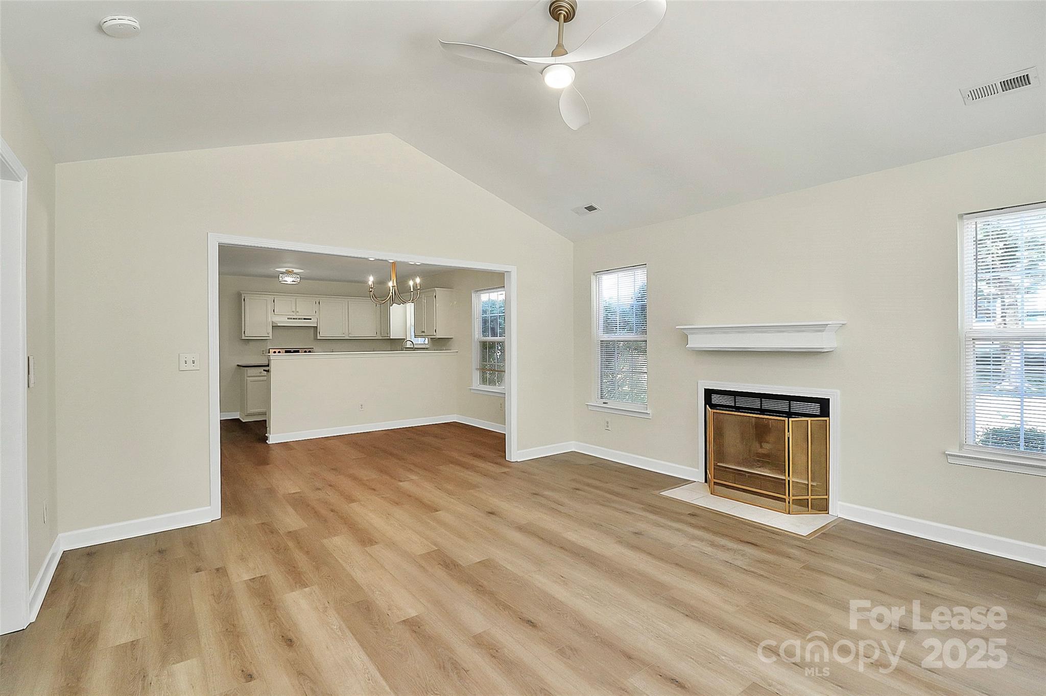 6320 Fresh Wind Avenue Charlotte, NC 28212 - Photo 5 of 31 a view of an empty room with a fireplace and a window
