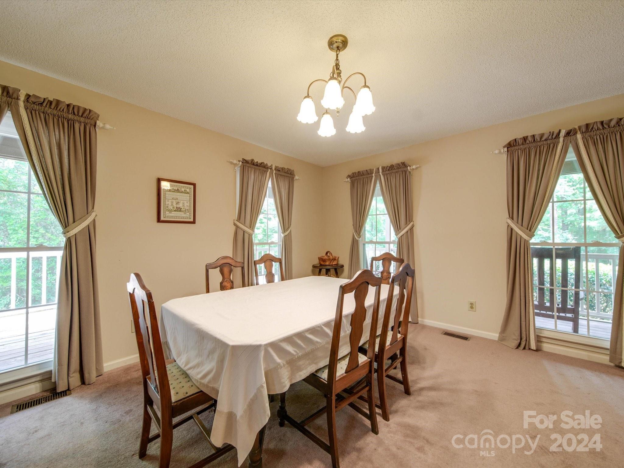 1557 Woodcroft Drive Fort Mill, SC 29708 - Photo 11 of 46 a view of a dining room with furniture window and outside view