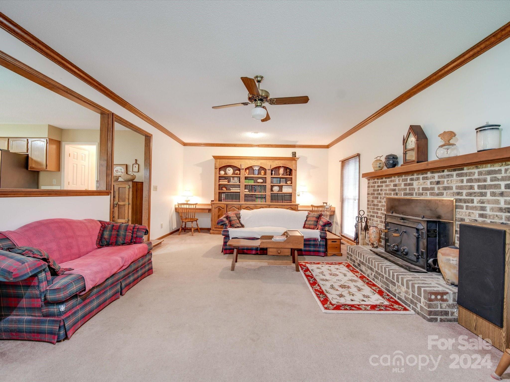 1557 Woodcroft Drive Fort Mill, SC 29708 - Photo 12 of 46 a living room with furniture and a fireplace
