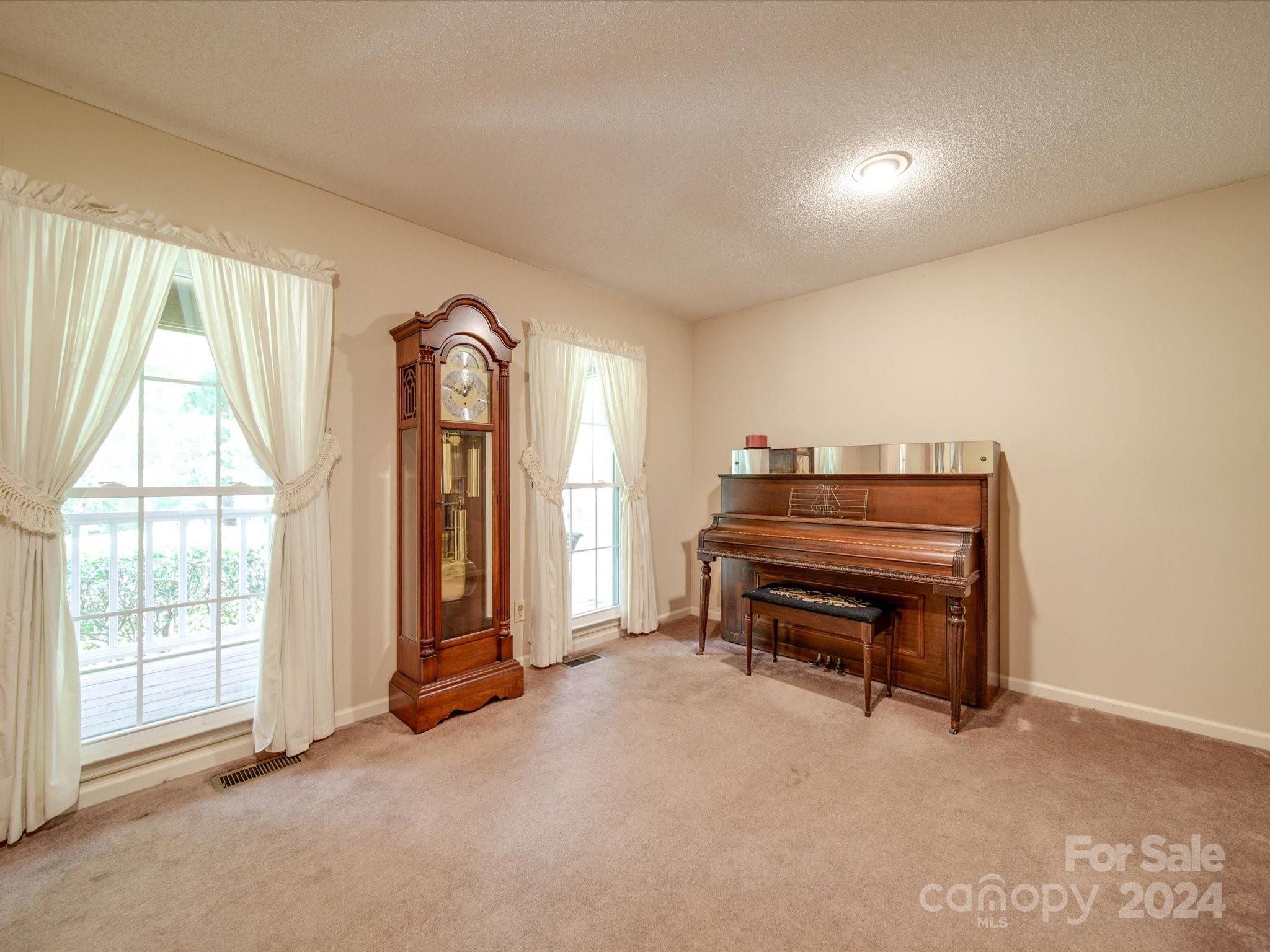 1557 Woodcroft Drive Fort Mill, SC 29708 - Photo 18 of 46 a living room with furniture and a window