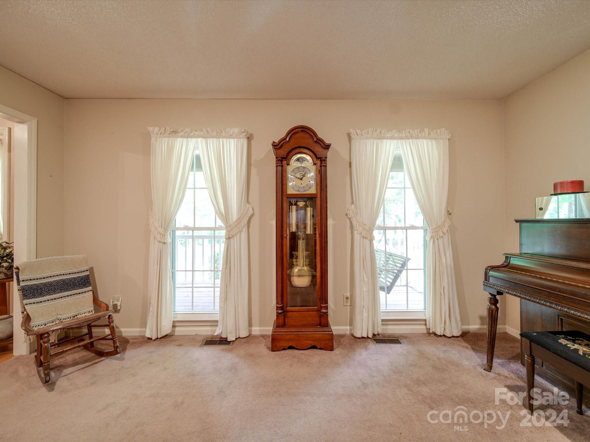 1557 Woodcroft Drive Fort Mill, SC 29708 - Photo 19 of 46 a view of an empty room with exposed radiator and a window