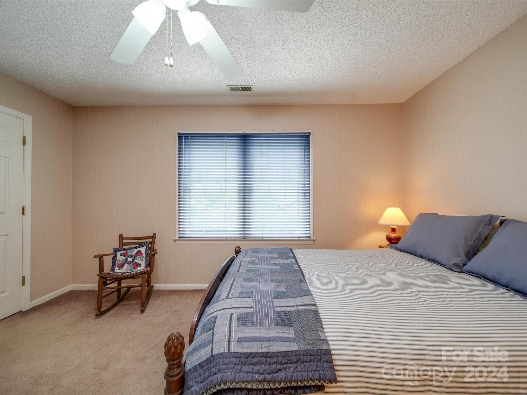 1557 Woodcroft Drive Fort Mill, SC 29708 - Photo 24 of 46 a bedroom with a bed and a window