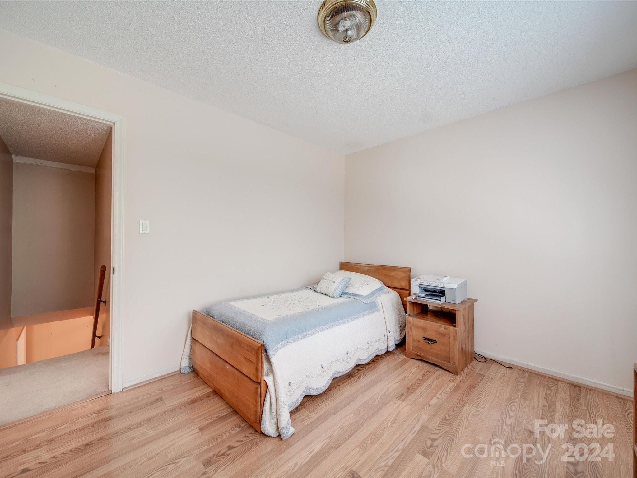 1557 Woodcroft Drive Fort Mill, SC 29708 - Photo 34 of 46 a bedroom with a bed and a table