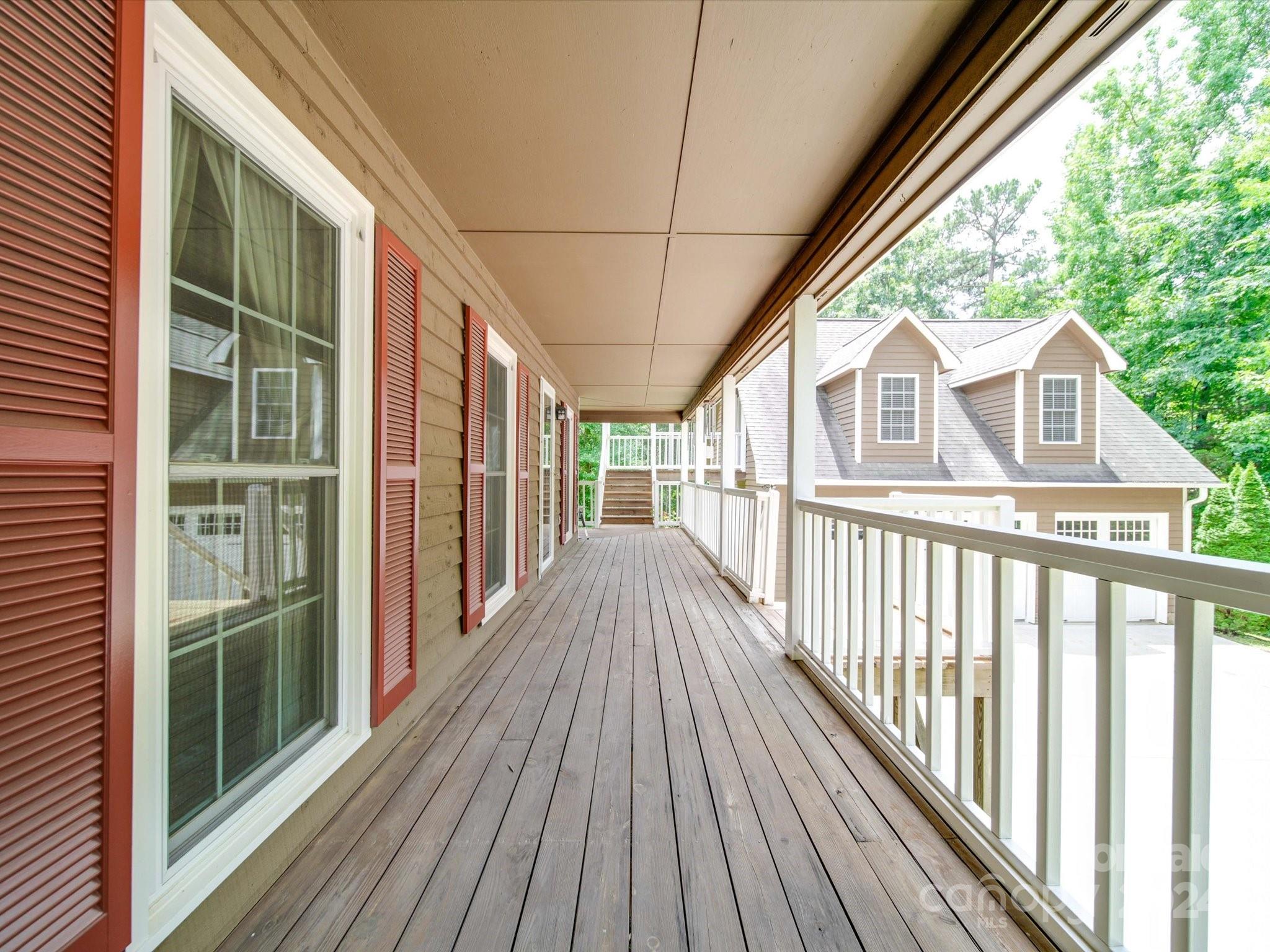 1557 Woodcroft Drive Fort Mill, SC 29708 - Photo 42 of 46 a view of backyard with large trees and wooden floor