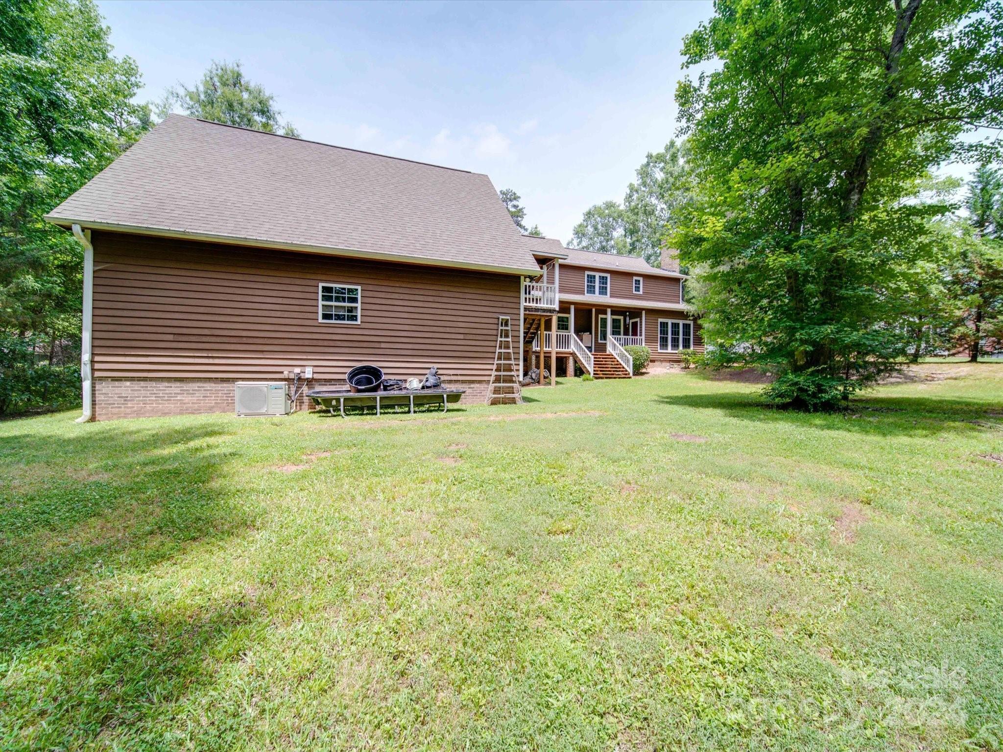 1557 Woodcroft Drive Fort Mill, SC 29708 - Photo 46 of 46 a brick house with a yard
