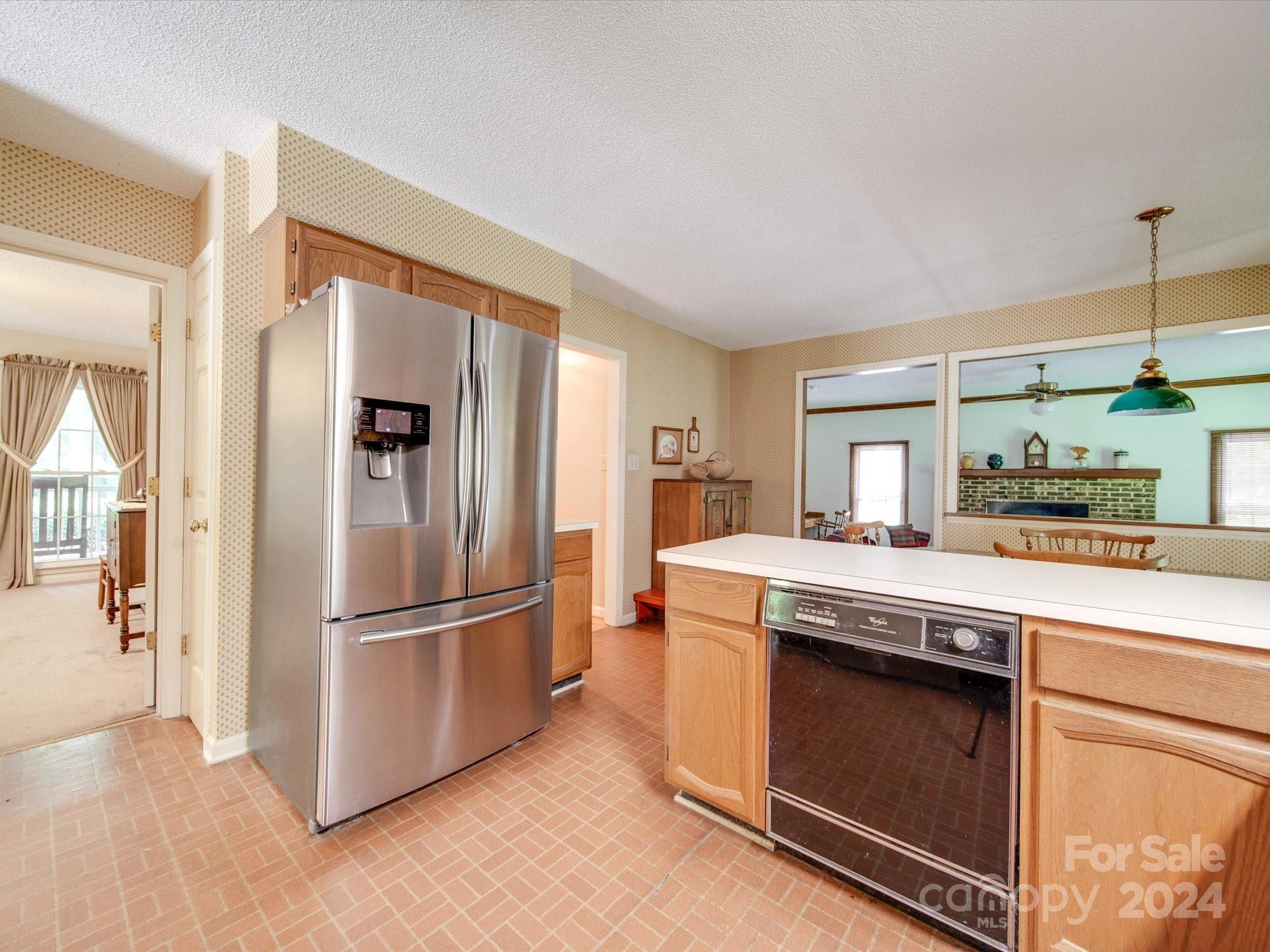 1557 Woodcroft Drive Fort Mill, SC 29708 - Photo 6 of 46 a kitchen with a stove top oven and refrigerator