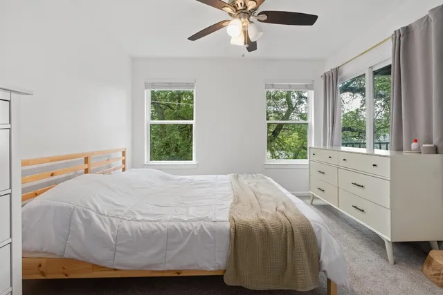 a bedroom with a bed and window