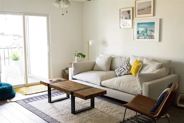 a living room with furniture and a window
