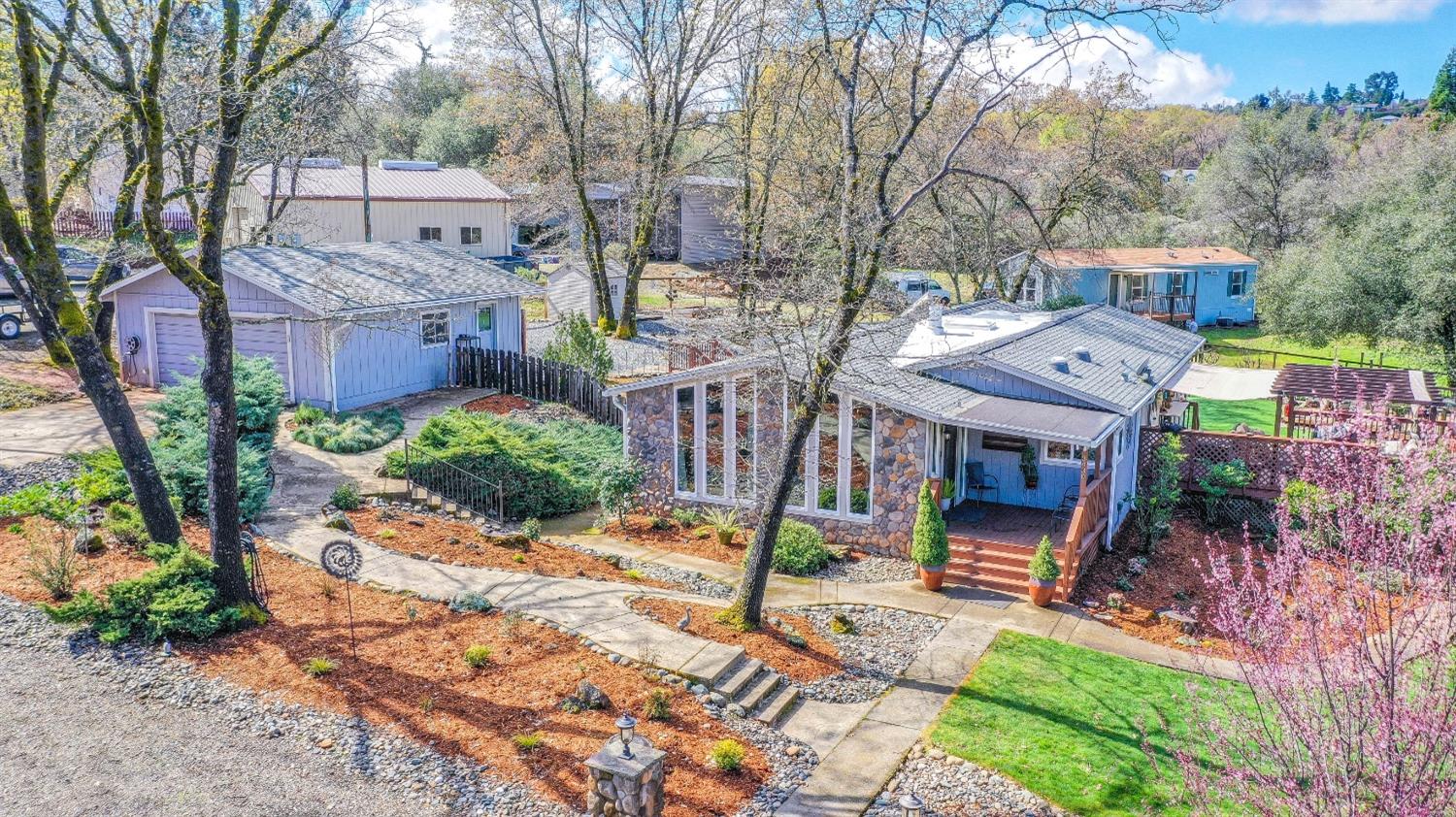 3430 Bridget Brae Road Shingle Springs, CA 95682 - Photo 1 of 1 Primary home with detached 2 car garage, Large Workshop off to left side with 2 RV parking/storage areas behind. Back of primary home is the 2 bedroom 1 bath second home.
