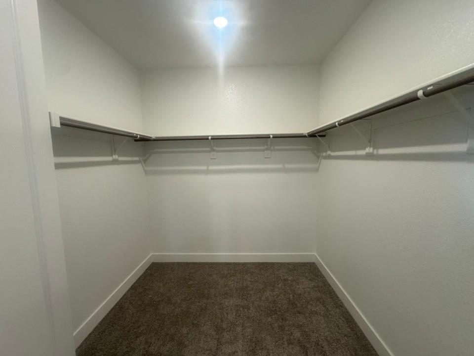 412 Indian Crk Road Van Alstyne, TX 75495 - Photo 15 of 24 a empty walk in closet with wooden floor