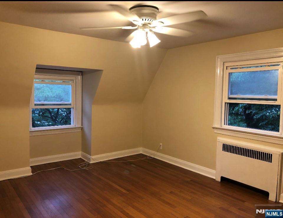 474 Grove Street Ridgewood, NJ 07450 - Photo 13 of 19 wooden floor in an empty room with a window