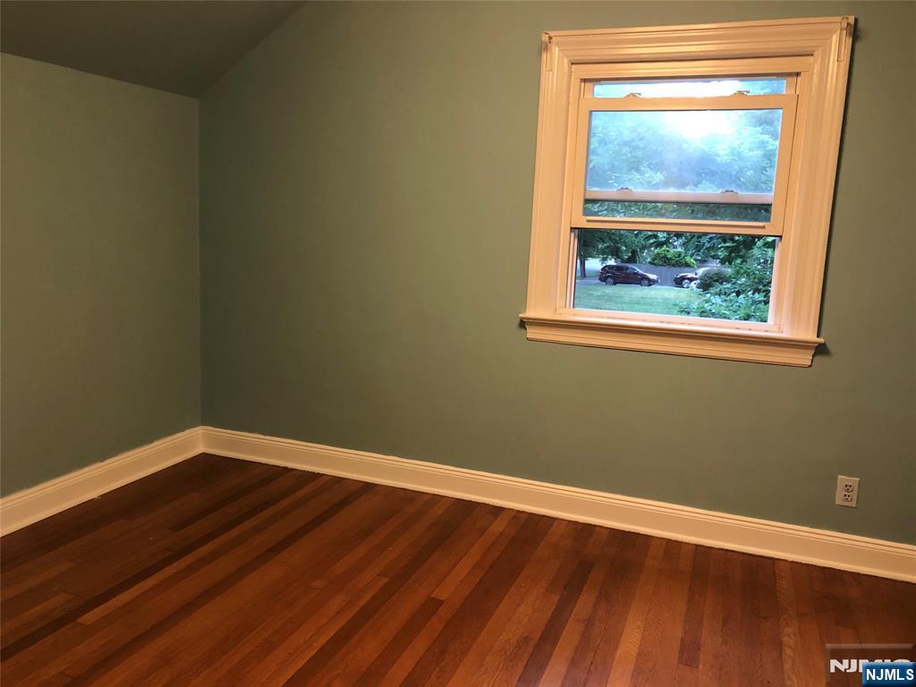 474 Grove Street Ridgewood, NJ 07450 - Photo 15 of 19 a view of a small space with wooden floor and a window