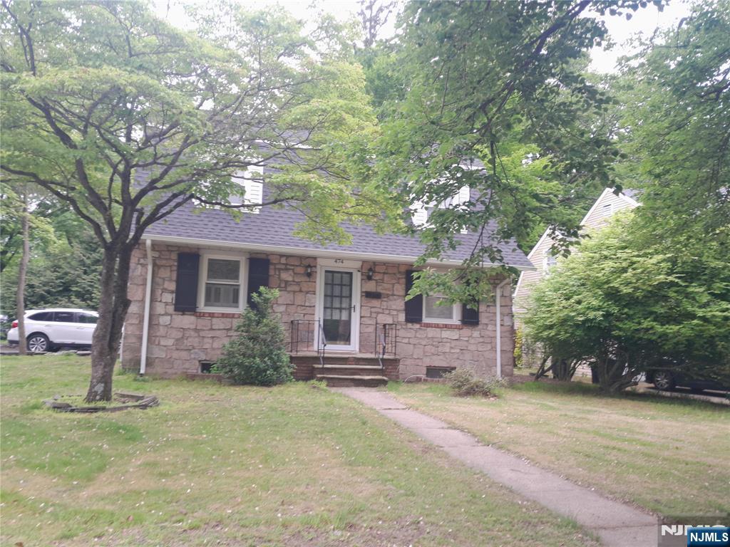 474 Grove Street Ridgewood, NJ 07450 - Photo 19 of 19 front view of a house with a tree
