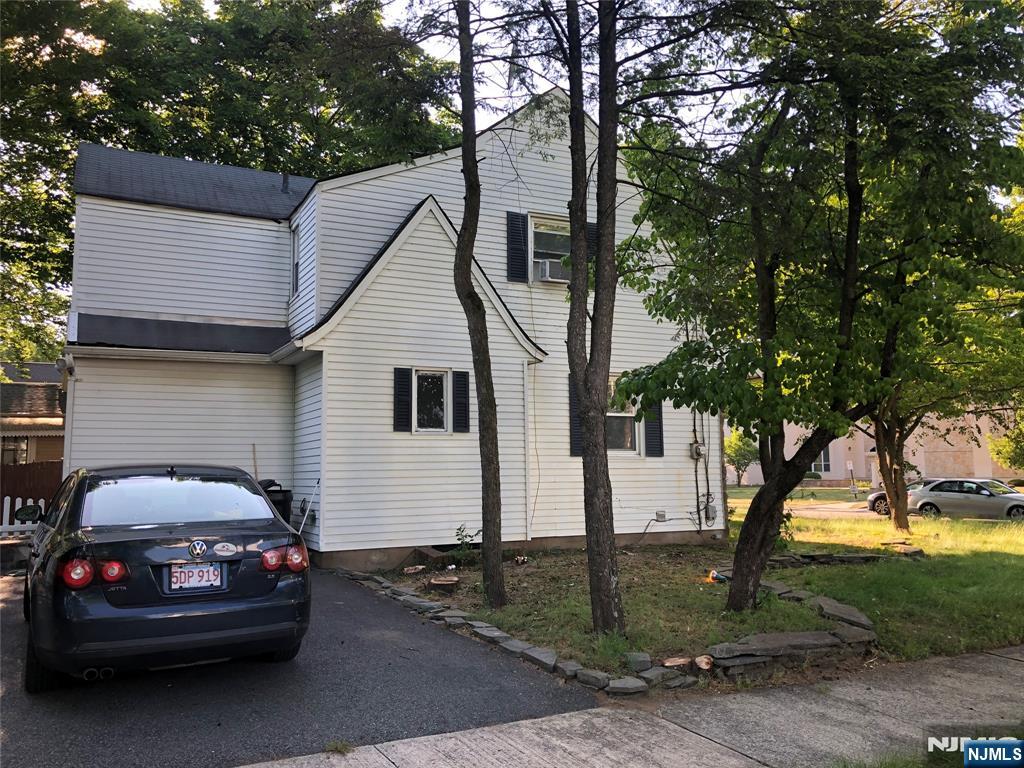 474 Grove Street Ridgewood, NJ 07450 - Photo 4 of 19 a view of a white car parked in front of a house