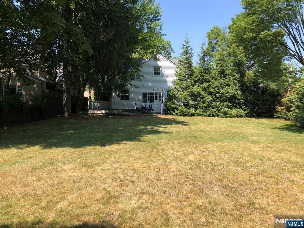 474 Grove Street Ridgewood, NJ 07450 - Photo 6 of 19 a view of a house with yard and trees