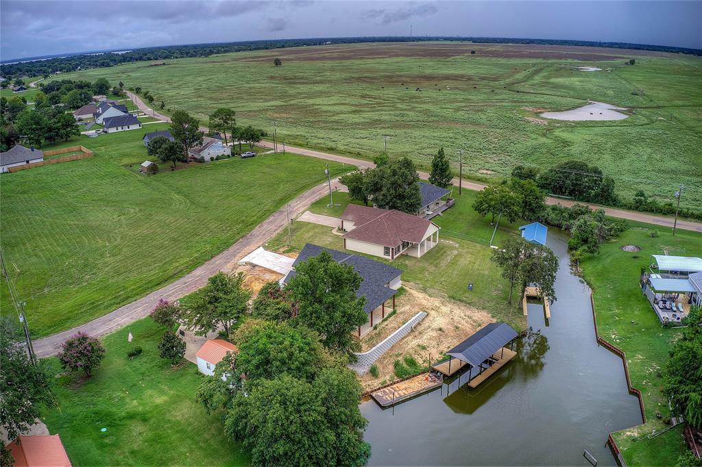 405 Door Key Ranch Road Trinidad, TX 75163 - Photo 29 of 30 an aerial view of a house with a garden and lake view