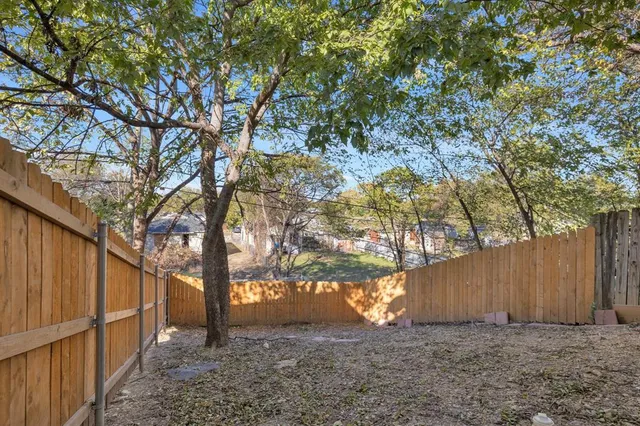 a view of backyard with large trees