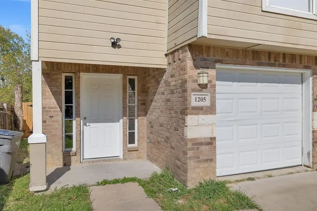 a front view of a house with a garage