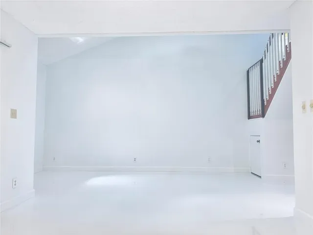 a bathroom with a granite countertop toilet and a shower