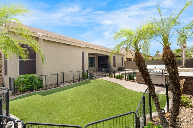 a swimming pool with outdoor seating and yard