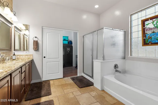a bathroom with a bathtub and a shower