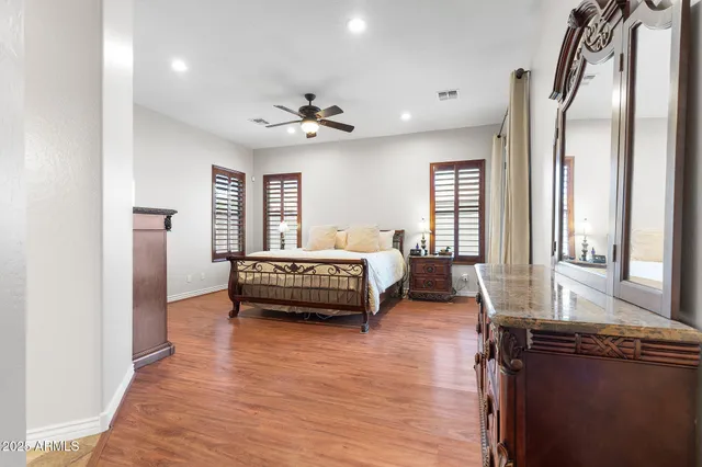 a bedroom with furniture and a window