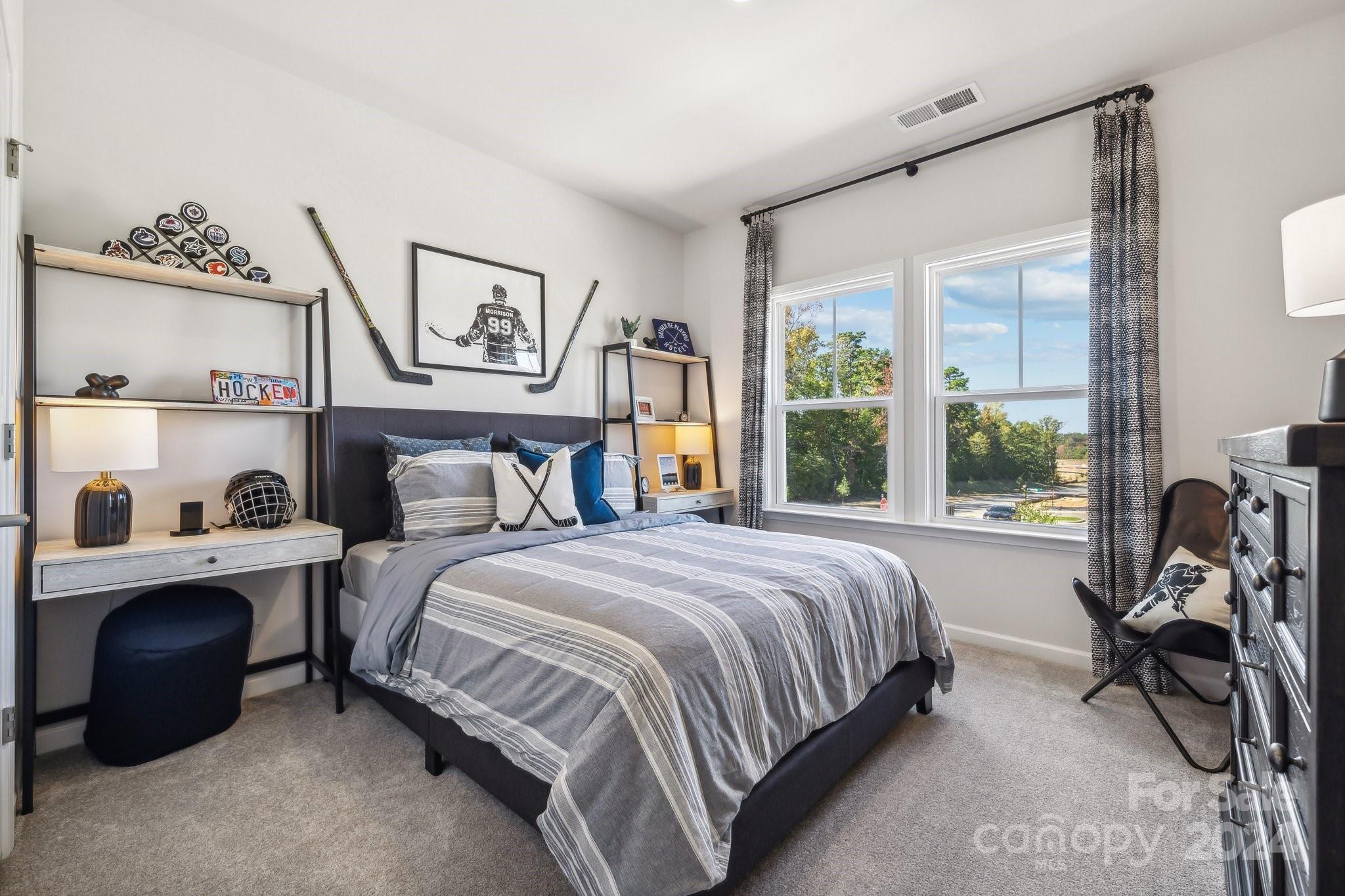 1406 Hubert Graham Way Tega Cay, SC 29708 - Photo 20 of 26 a bedroom with a bed and a window