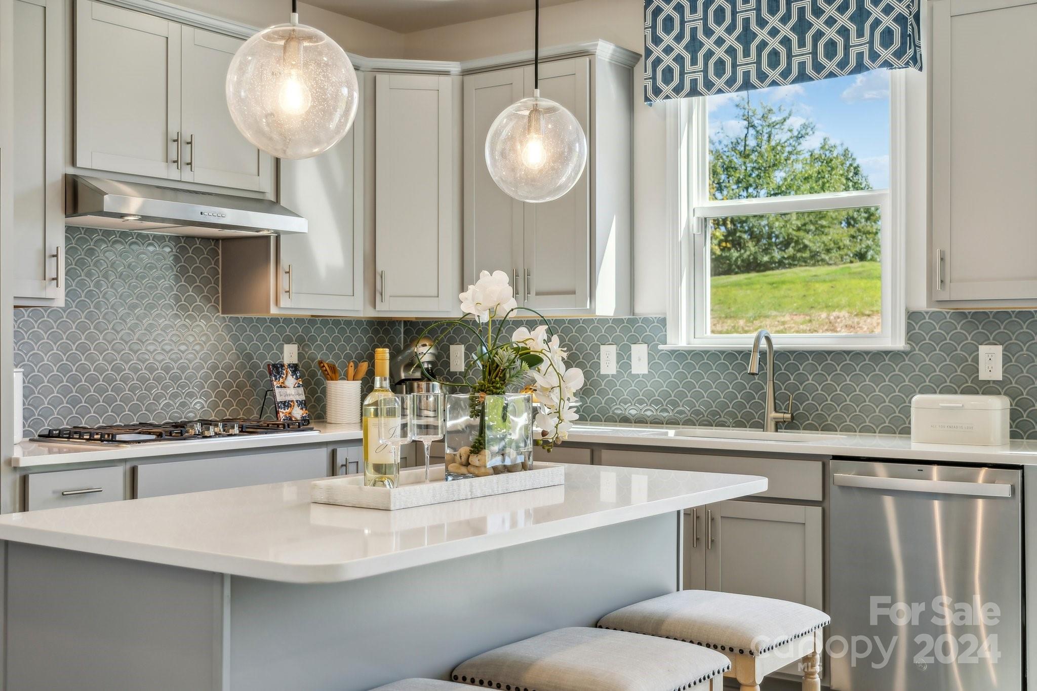 1406 Hubert Graham Way Tega Cay, SC 29708 - Photo 24 of 26 a kitchen with a sink and a window