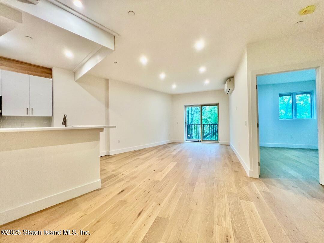 3865 Amboy Road, Unit 3F Staten Island, NY 10308 - Photo 3 of 20 a view of an empty room and window