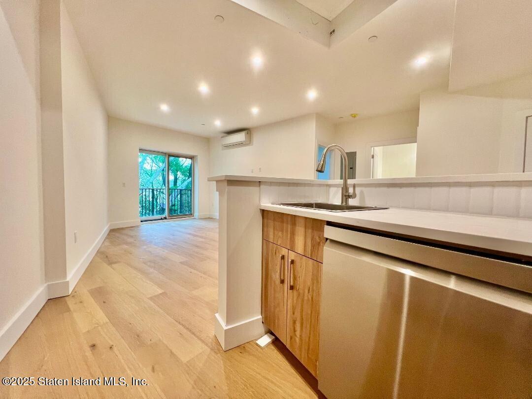 3865 Amboy Road, Unit 3F Staten Island, NY 10308 - Photo 4 of 20 a kitchen with stainless steel appliances granite countertop a sink a stove and a refrigerator
