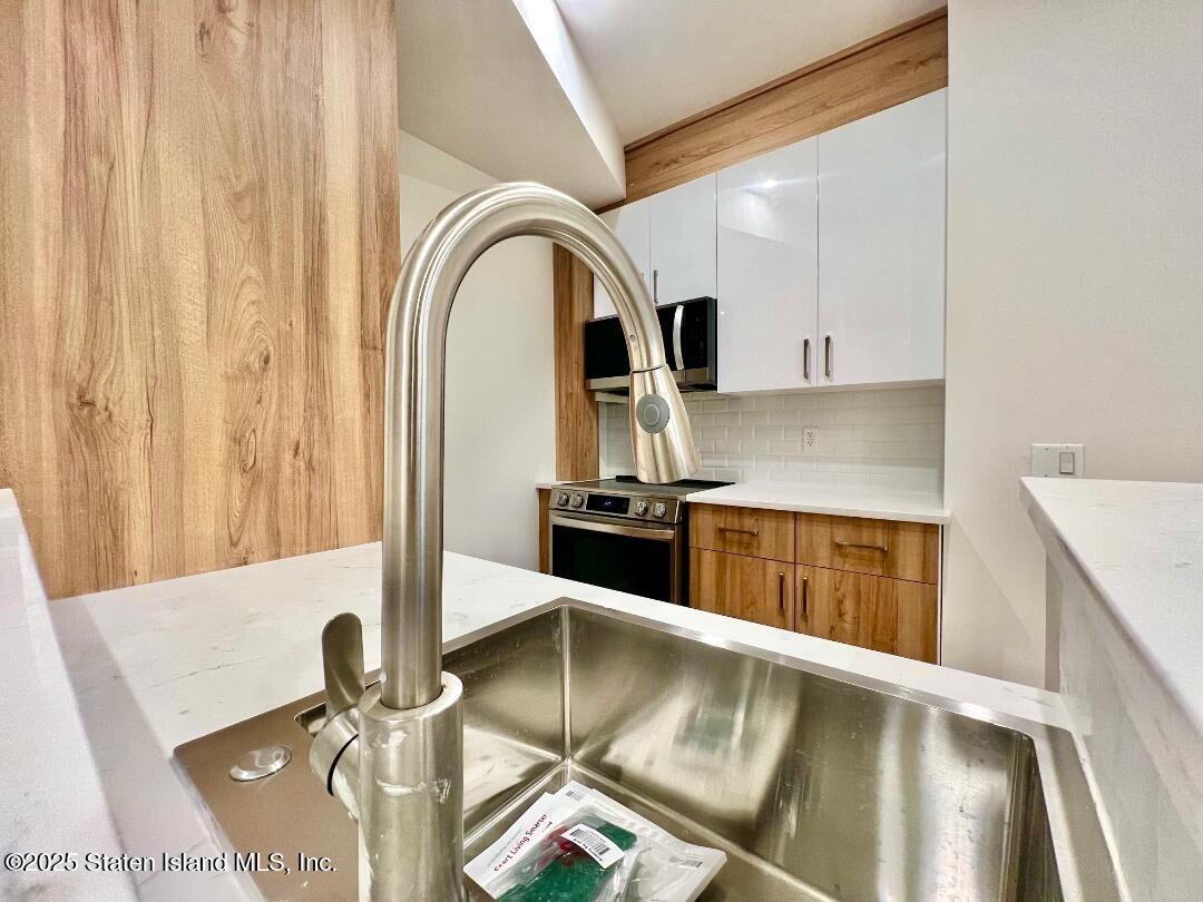3865 Amboy Road, Unit 3F Staten Island, NY 10308 - Photo 7 of 20 a view of a kitchen with kitchen island