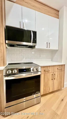 a kitchen with a stove and a microwave