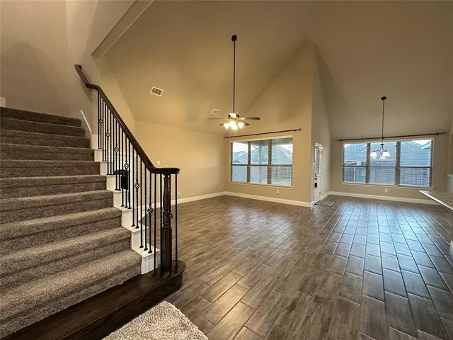 a view of an entryway with wooden floor