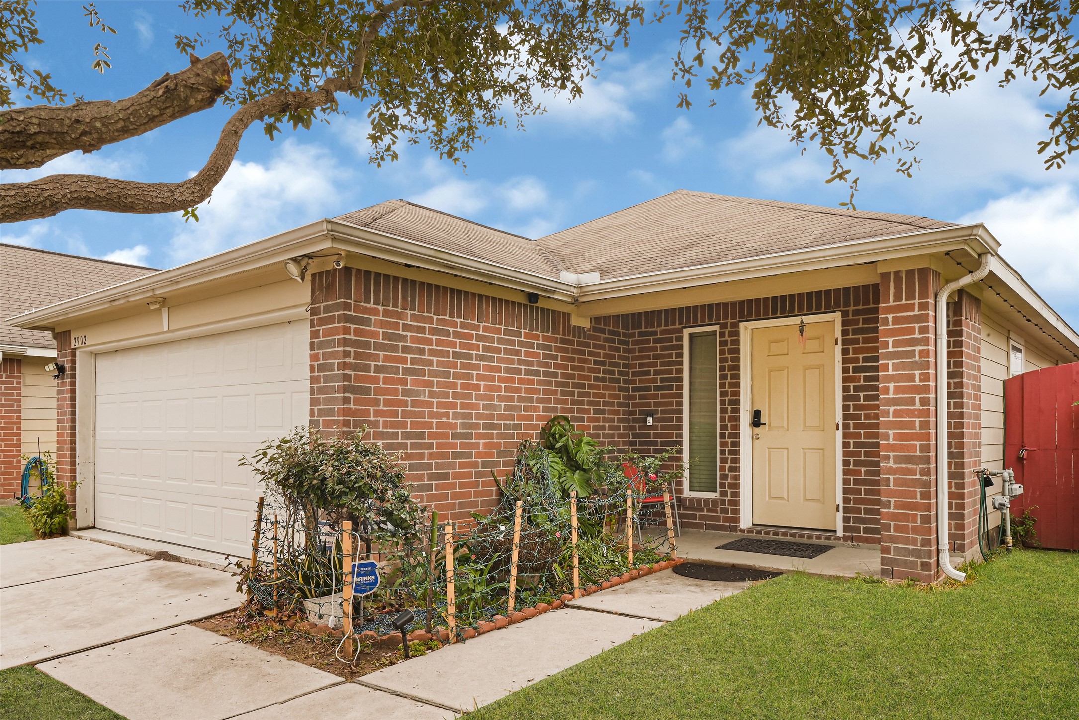 2902 Back Bay Brook Trail Houston, TX 77045 - Photo 3 of 20 a front view of a house with garden