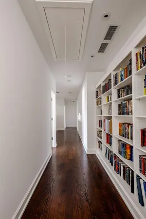 a view of livingroom with furniture and book shelf
