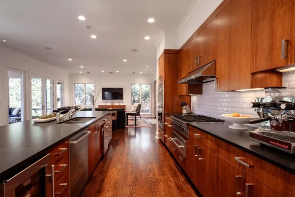 a kitchen with lots of counter top space a sink and appliances