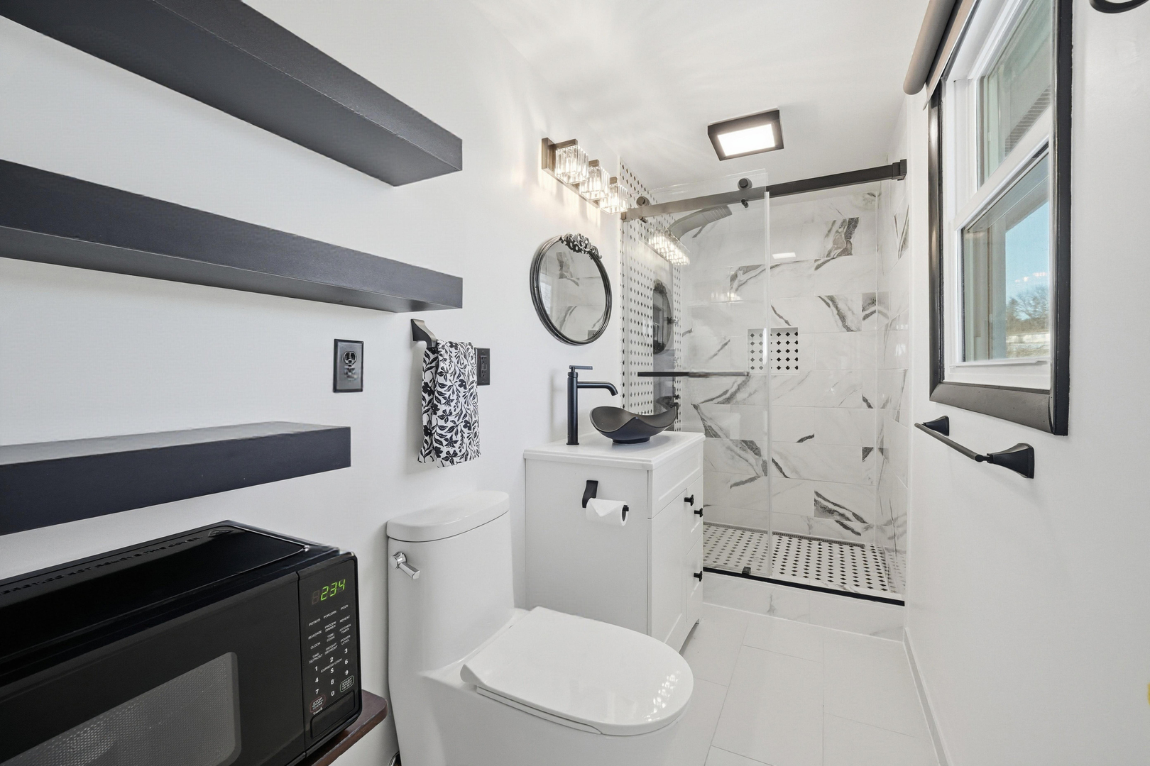 9807 North Leaf River Road Leaf River, IL 61047 - Photo 17 of 38 a bathroom with a toilet a sink and a shower
