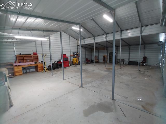 34015 Big Springs Road Yoder, CO 80864 - Photo 13 of 19 inside the barn from access door
