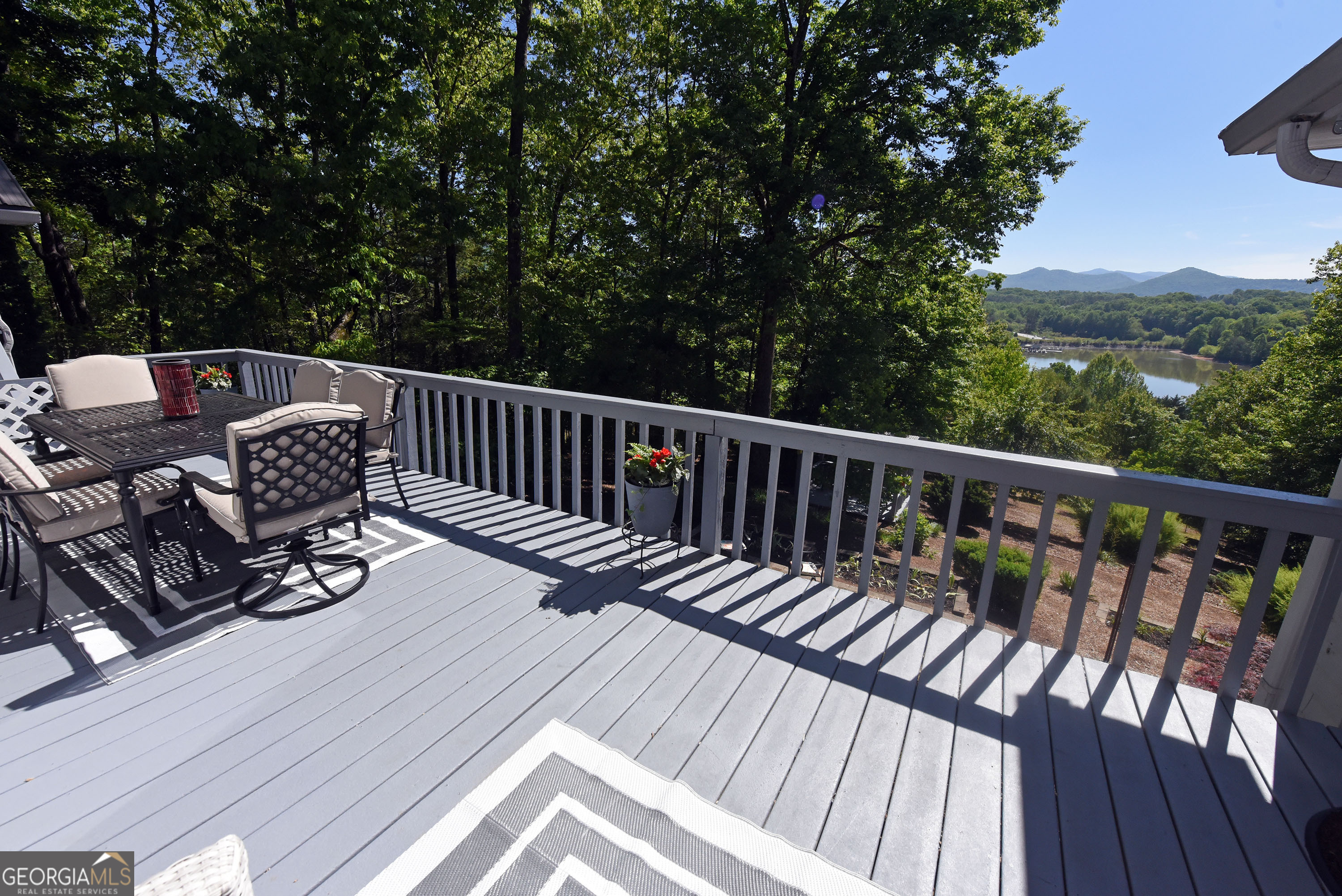 382 Pat Colwell Road, Unit TRACT 1 Blairsville, GA 30512 - Photo 20 of 43 a view of a two chairs on the roof deck