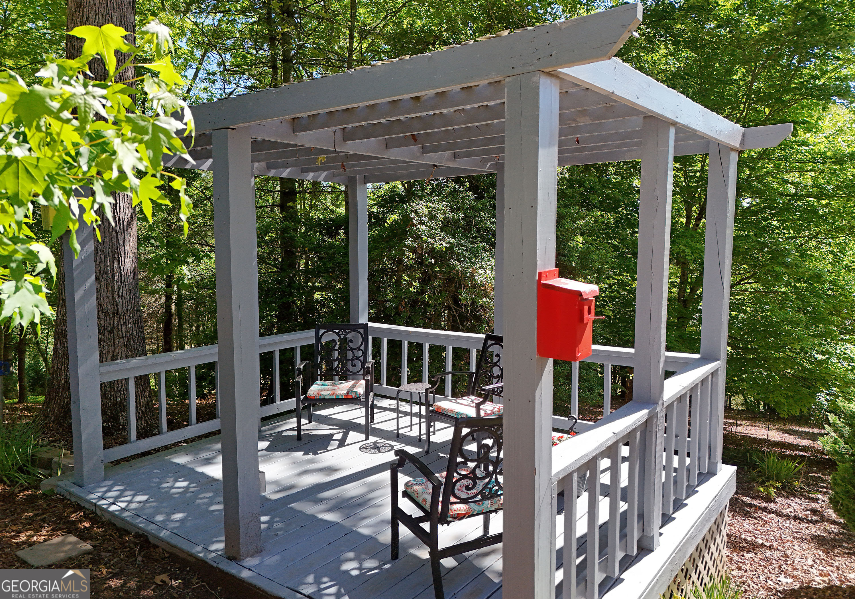 382 Pat Colwell Road, Unit TRACT 1 Blairsville, GA 30512 - Photo 32 of 43 a view of a wooden deck and a backyard