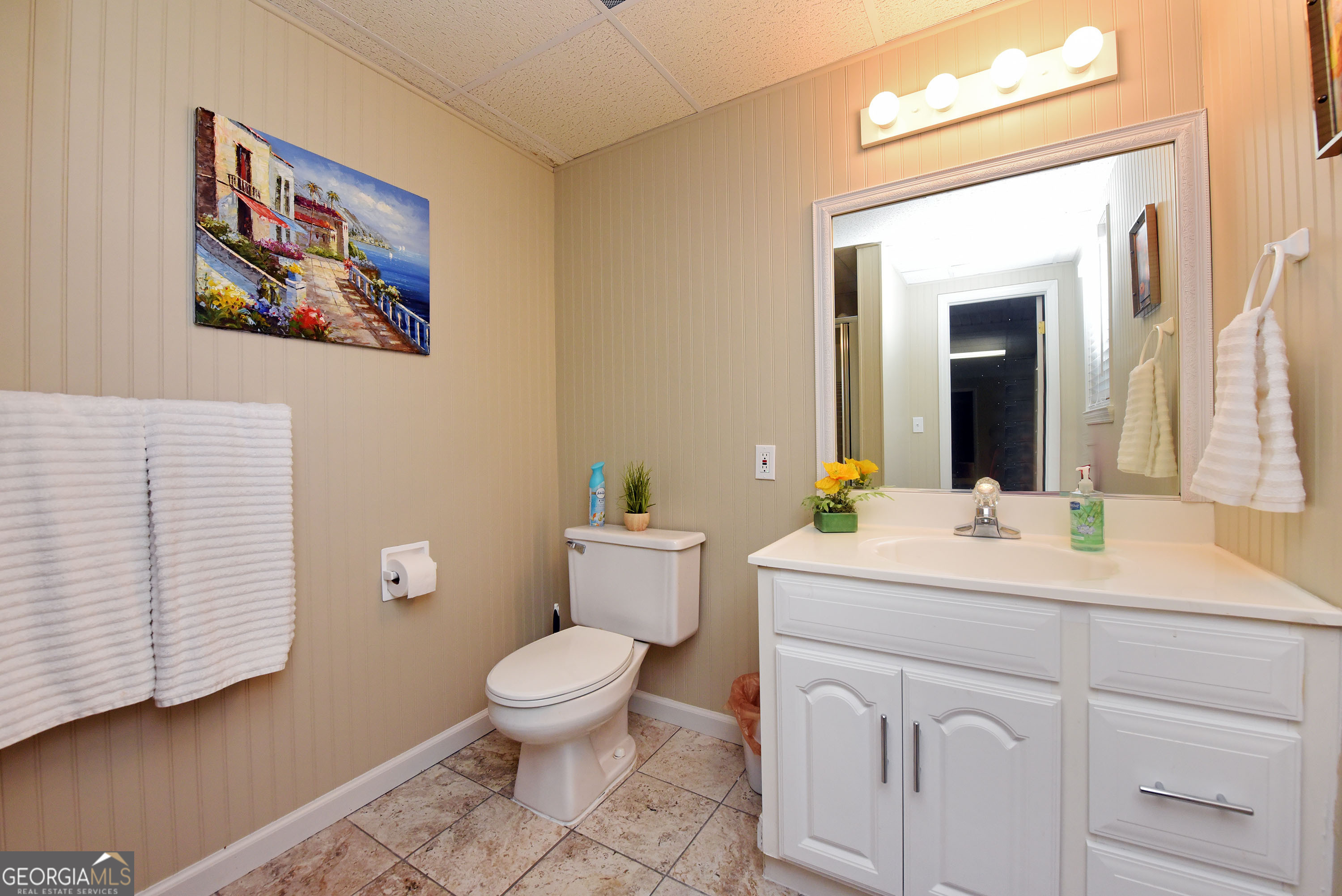 382 Pat Colwell Road, Unit TRACT 1 Blairsville, GA 30512 - Photo 38 of 43 a spacious bathroom with a toilet a sink and mirror