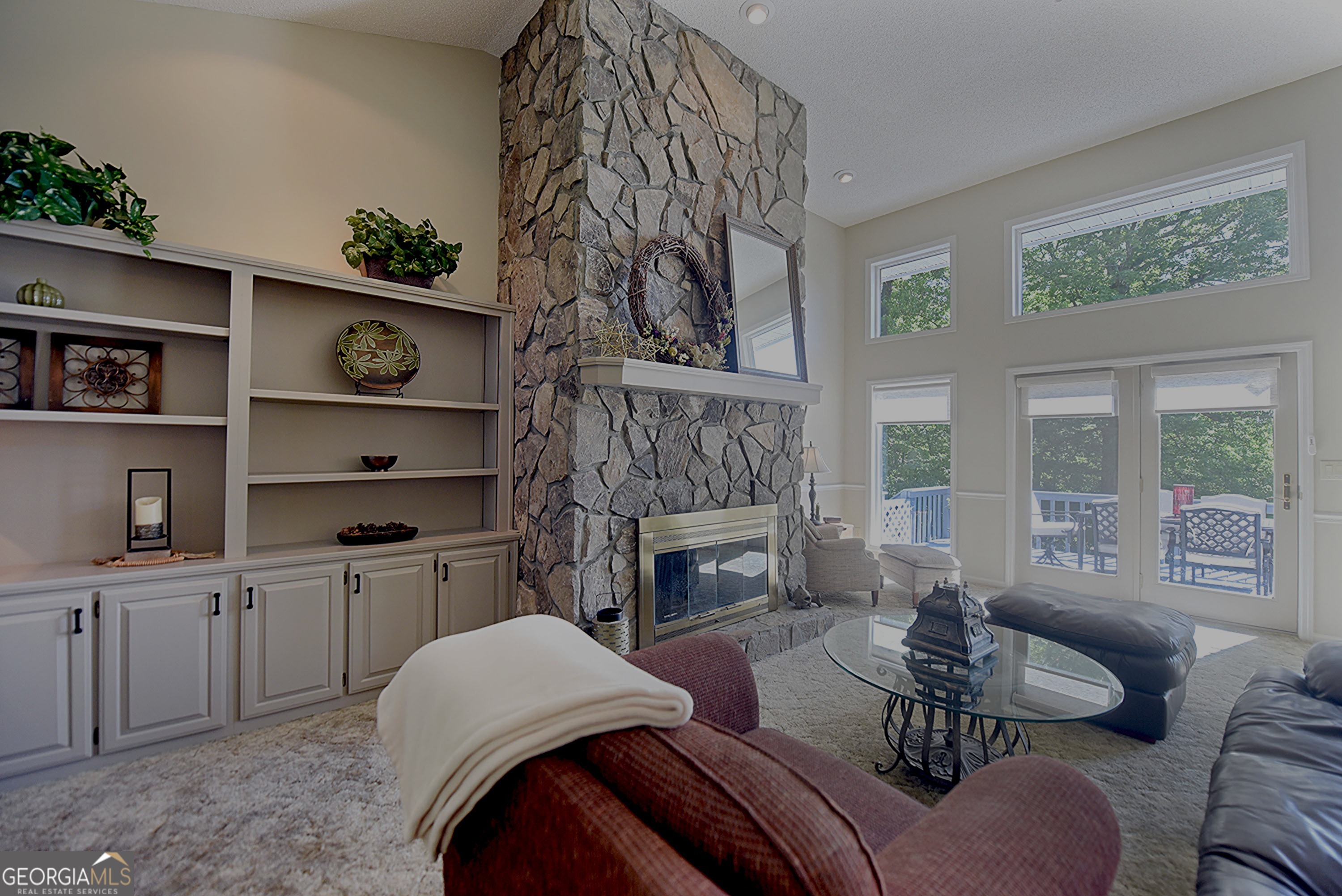 382 Pat Colwell Road, Unit TRACT 1 Blairsville, GA 30512 - Photo 6 of 43 a living room with furniture a fireplace and a large window