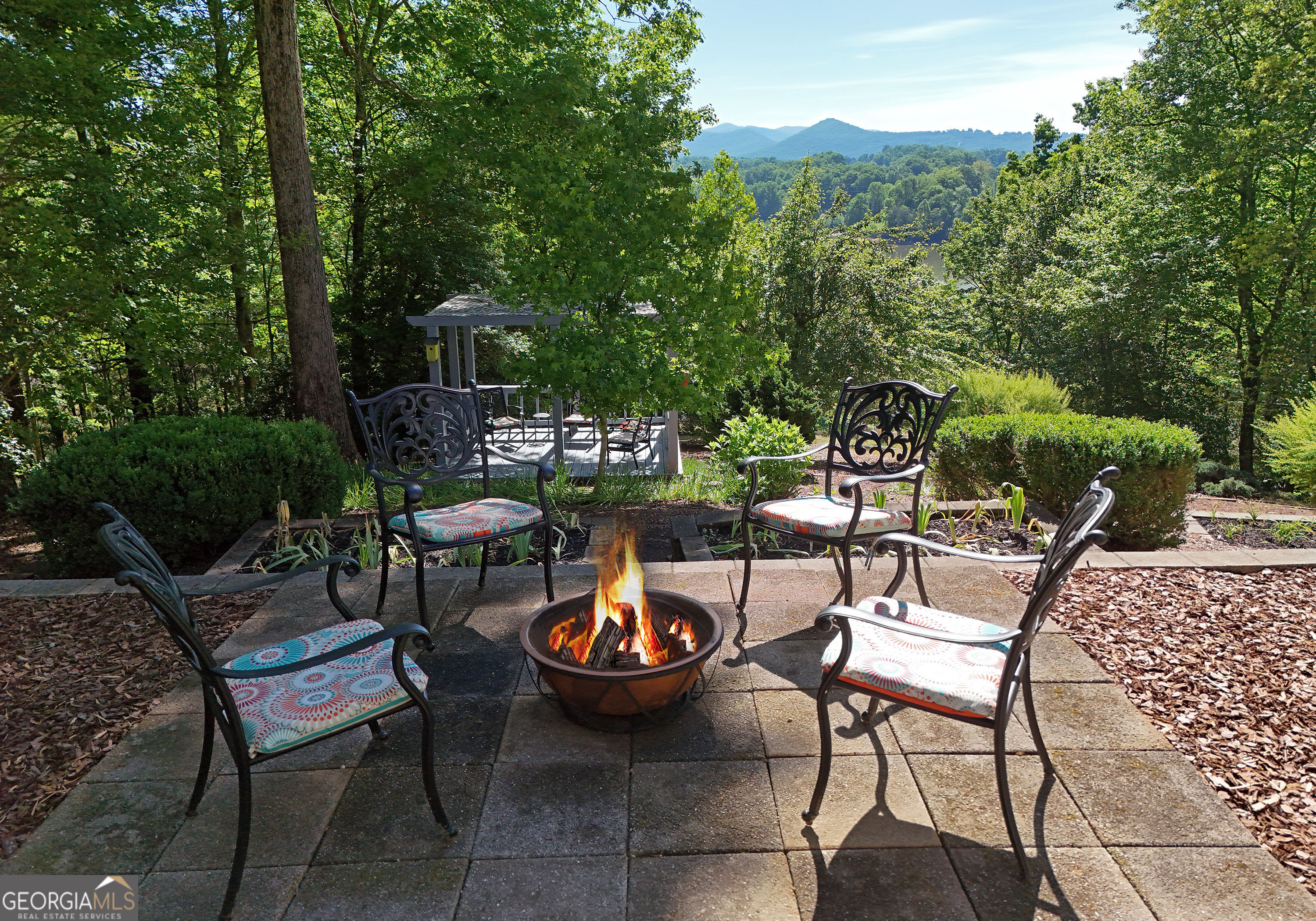 382 Pat Colwell Road, Unit TRACT 1 Blairsville, GA 30512 - Photo 10 of 43 a view of a chairs and table in backyard
