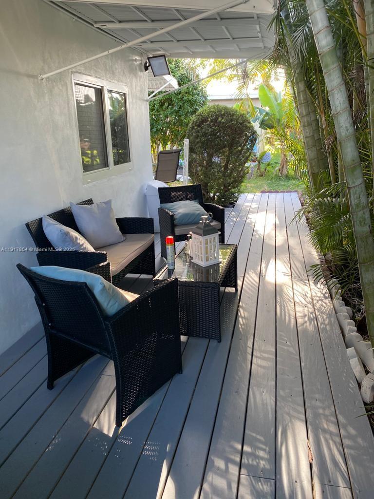 7303 Northwest 57th Drive, Unit 7303 Tamarac, FL 33321 - Photo 12 of 15 a balcony view with a seating space