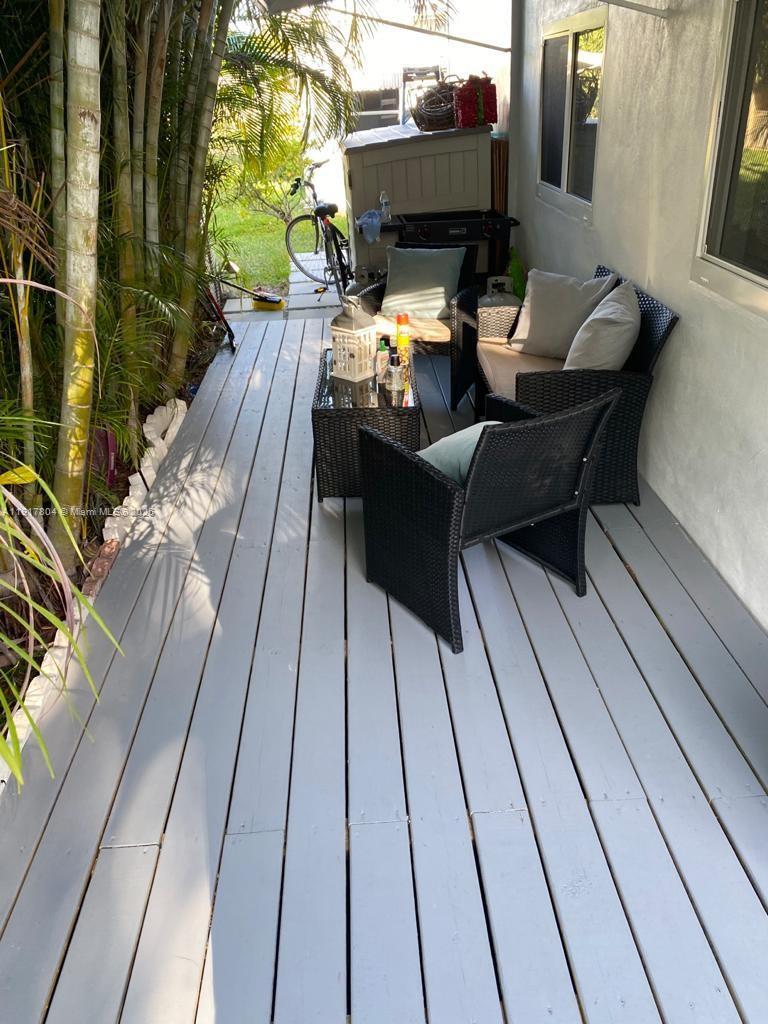 7303 Northwest 57th Drive, Unit 7303 Tamarac, FL 33321 - Photo 13 of 15 a living room with furniture