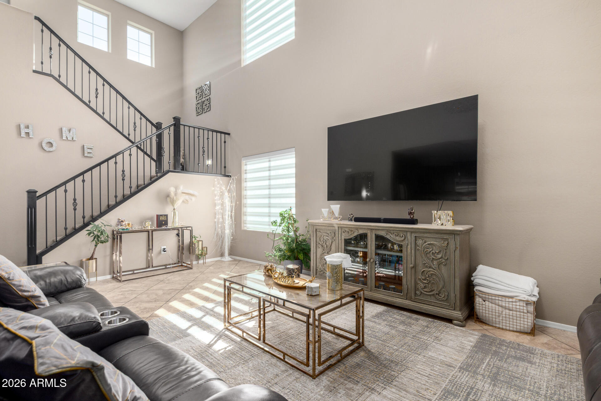 10816 West Nosean Road Peoria, AZ 85383 - Photo 11 of 42 a living room with furniture and a flat screen tv