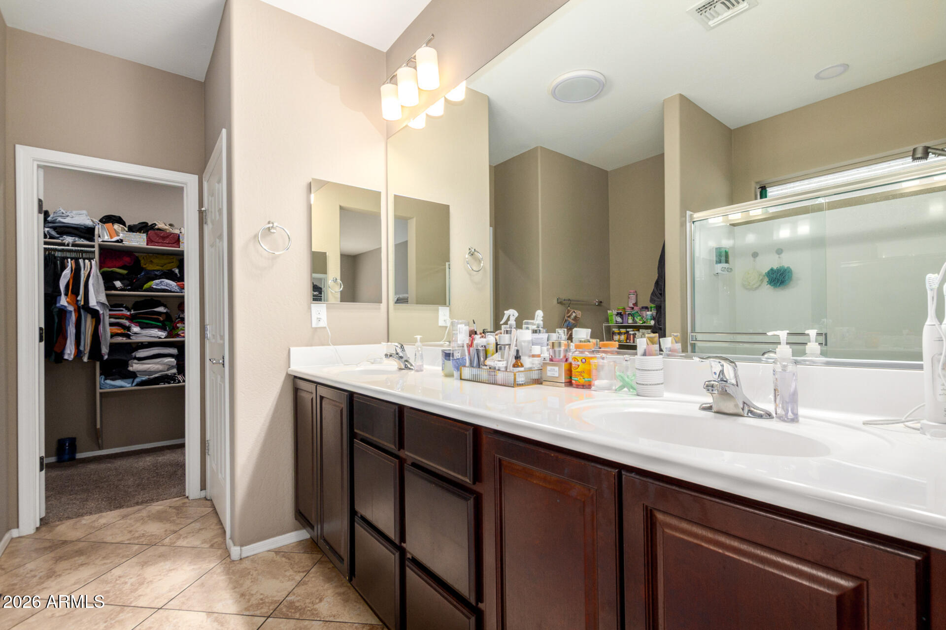 10816 West Nosean Road Peoria, AZ 85383 - Photo 20 of 42 a bathroom with a sink double vanity and a mirror